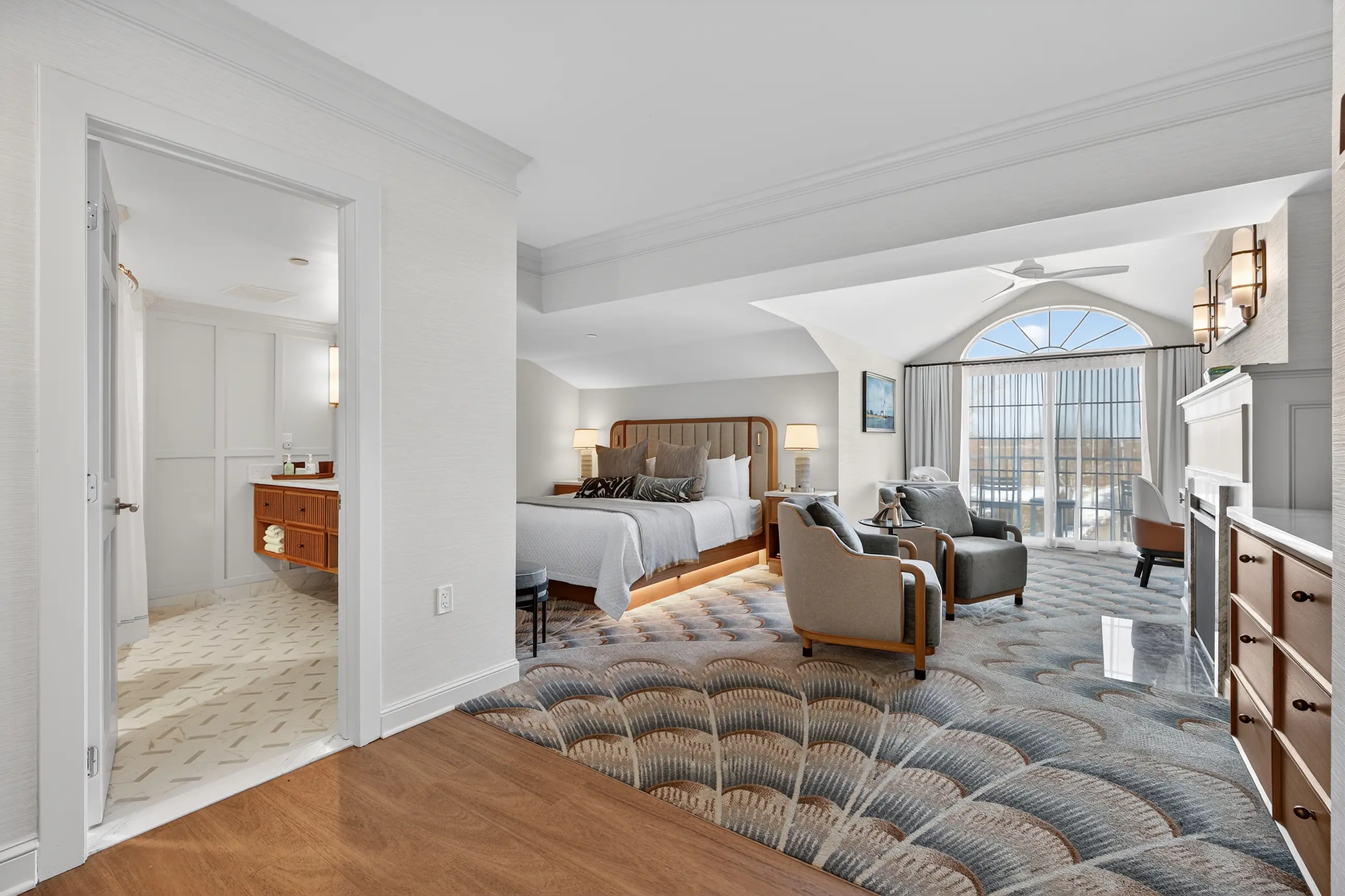 Wine and bread on tray in hotel room.