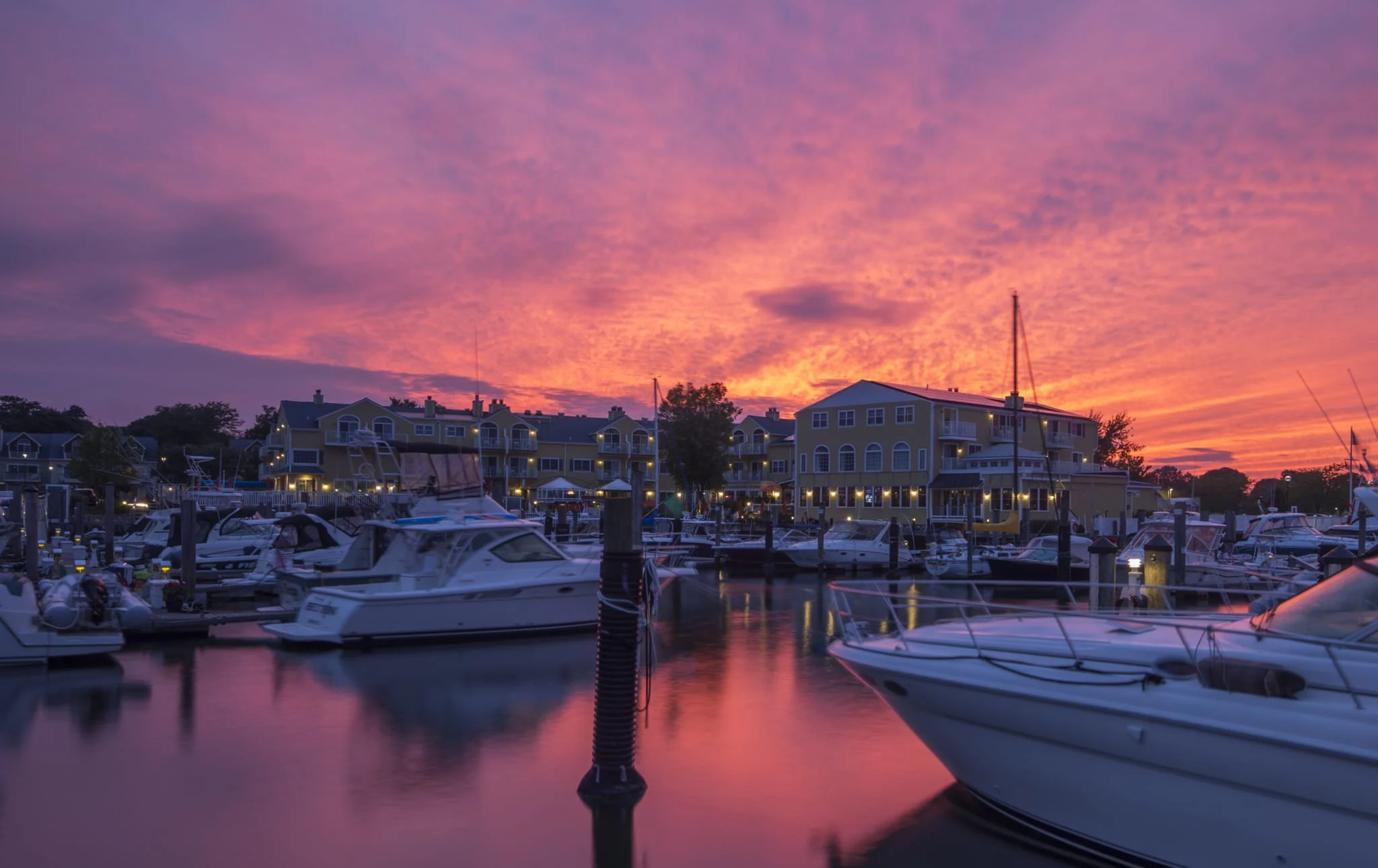 Boats in marina at sunset.