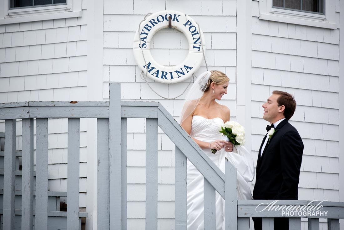 Bridal couple together at Connecticut lighthouse.