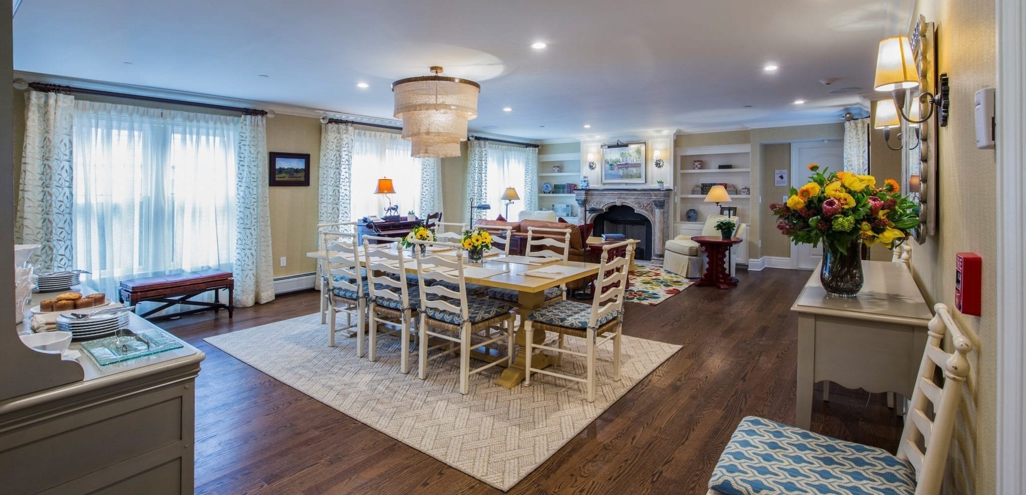 Open concept dining and living room in guest house.