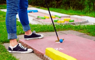 Photo of a Person Playing Mini-Golf near Old Saybrook, CT.