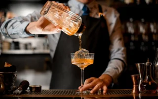 A bartender fixes a old-fashioned cocktail at Old Saybrook's Choo Choo Lounge, a great spot for small food bites and classic drinks.